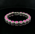 Oval Tennis Bracelet – Ruby and White Topaz