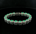 Oval Tennis Bracelet – Emerald and White Topaz