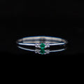 Katharine White – 18ct White Gold with 0.04ct Natural Diamonds and 0.04ct Emerald